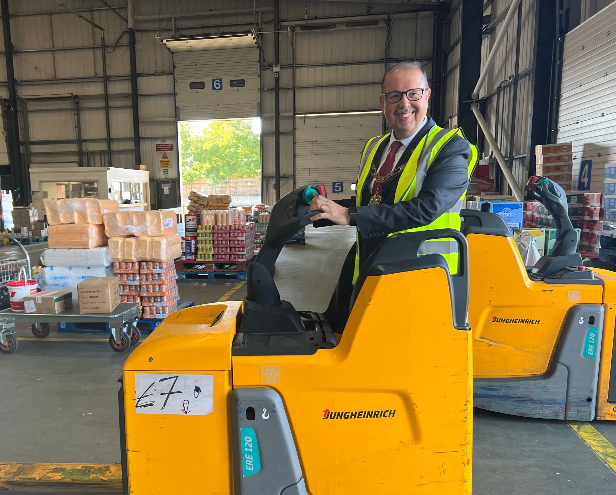 Do not try this at home – Mr Mayor sits in an electronic warehouse vehicle 