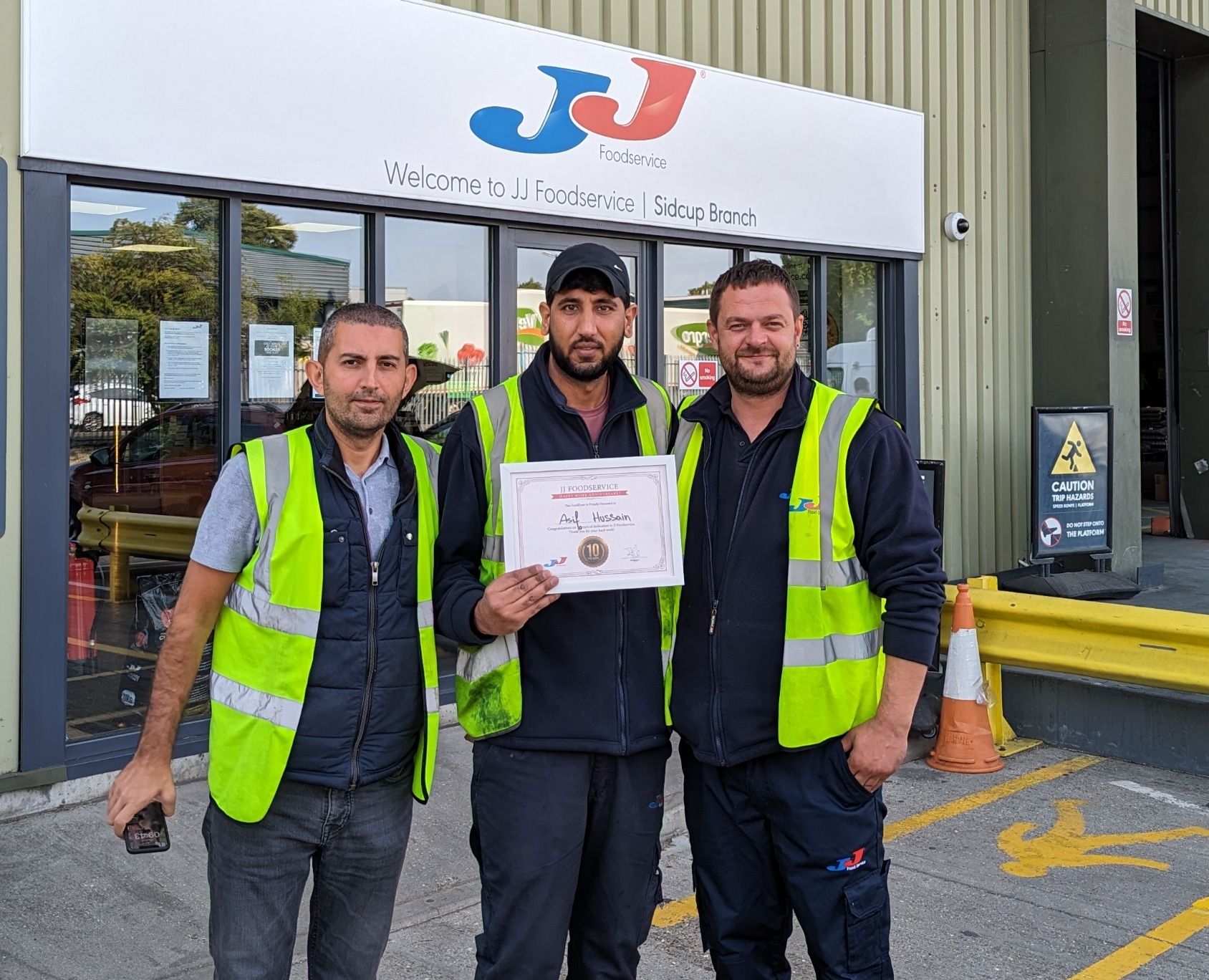 Sidcup team members being awarded an Anniversary Certificate 